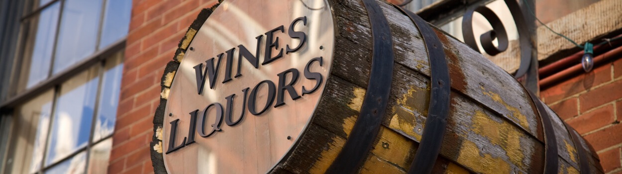 A barrel with the label 'Wines Liquors'